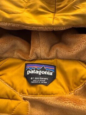 Patagonia kids' puffer jacket in mustard yellow